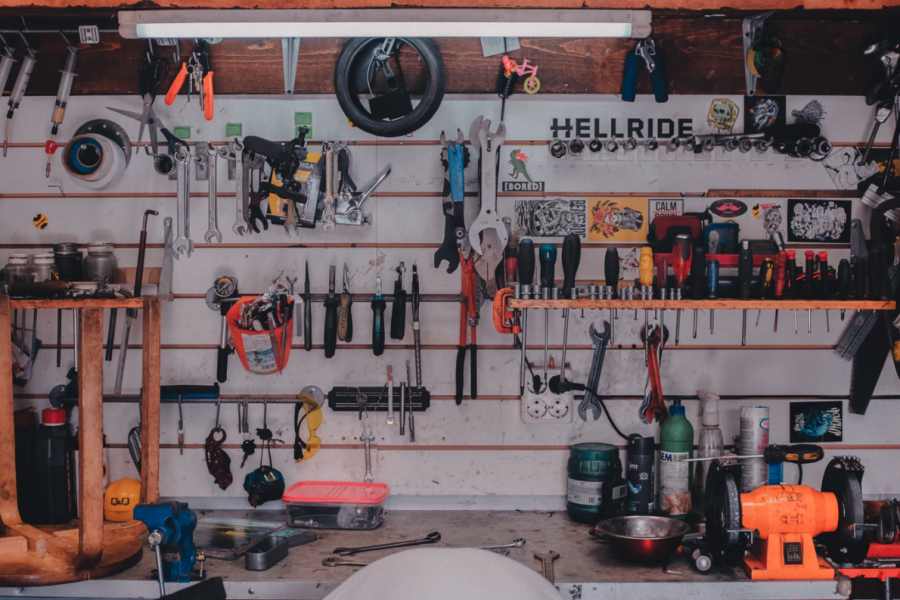 a wall of tools at a repair shop